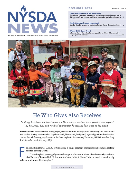 Group of small children standing with gray haired man